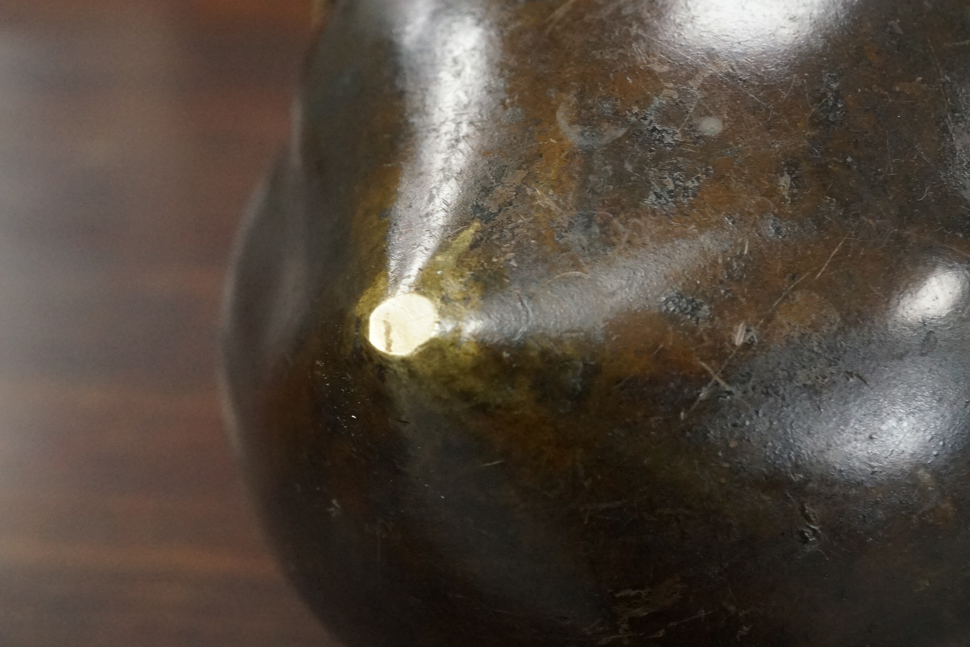 A large Chinese bronze and parcel gilt ‘peach’ censer and cover, Li, 17th/18th century
